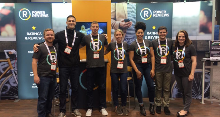 Photo of PowerReviews team at a conference